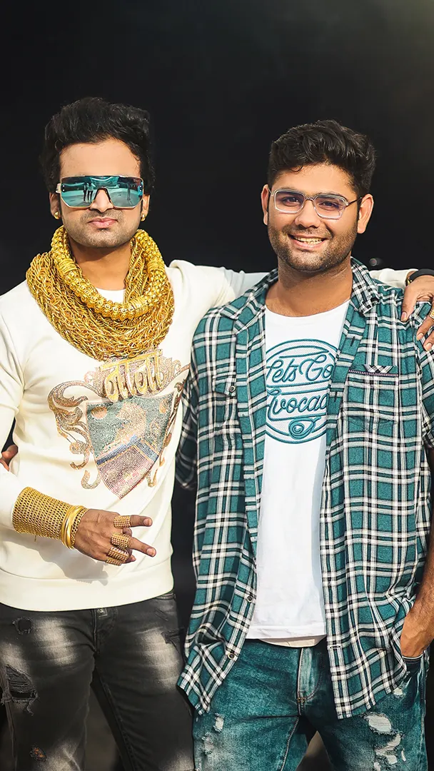 Ashu Gandhi with a collaborator at an event